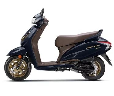 Honda Activa on the road, offering superior comfort, smooth rides, & a stylish design for commuting.